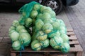 There are many sacks of cabbage on the pallet. Royalty Free Stock Photo