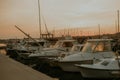 There are many yachts, boats and ships at sea. Marina at sunset Royalty Free Stock Photo