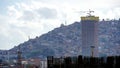 There are modern skyscrapers and constructions of them at the background of the slum neighborhood