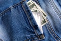 There is money and a condom in the jeans pocket Royalty Free Stock Photo