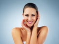 There is much effort in having perfect skin. Studio shot of a beautiful and healthy young woman against a blue