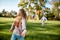 There is no better gift than a family. Little girl playing frisbee with her family in the park on a sunny day Royalty Free Stock Photo