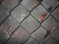 Chain link mesh on a gray painted background - vandal-proof protection of municipal and departmental property. no graffiti Royalty Free Stock Photo