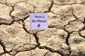 There is no planet b banner on arid cracked soil.