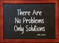 There are no problems only solutions. Motivational Quote by John Lennon on blackboard