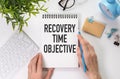 There is notebook with the word Recovery Time Objective. It is as an eye-catching image.