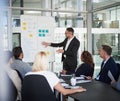 There is one or two things we really need to focus on. a mature businessman explaining work related stuff during a Royalty Free Stock Photo