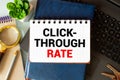 There is a piece of paper with the word Click Through Rate on notebook with red cube Royalty Free Stock Photo