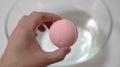 There is a pink bath ball in his hand Royalty Free Stock Photo