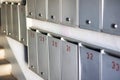 There is a row of mailboxes that display the numbers 28, 31, and 32 on them Royalty Free Stock Photo