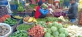 A old Man selling and other young Man purchasing fresh vegetables