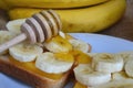 there are sandwiches with banana and honey on the plate