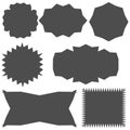 There are seven dark gray stickers of various shapes