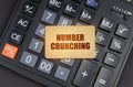 There is a sign on the calculator that says - Number crunching