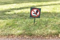 There is a sign on the lawn with a sign forbidding walking on the grass Royalty Free Stock Photo