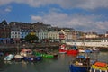 The old iconic traditional waterfront colourful shophouses with small boats at Cobh, Republic of Ireland