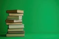 There is a stack of books, and on the top, there is an open book Royalty Free Stock Photo