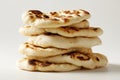 There is a stack of freshly baked flatbreads on a white surface, which are naan bread Royalty Free Stock Photo