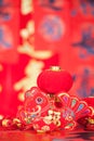 There are surplus ornaments and red lanterns every year in front of the red couplet background