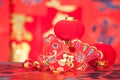 There are surplus ornaments and red lanterns every year in front of the red couplet background