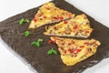 there are three pieces of pizza on the board together, with leafy sprou Royalty Free Stock Photo