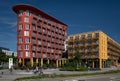 There are two large residential buildings in Augsburg that are used as dormitories. The houses are red and yellow. There are many