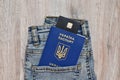 there is a Ukrainian passport and a bank card in his jeans pocket