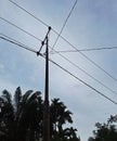 there was an electric pole with two wires barely untied. Royalty Free Stock Photo