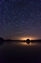 Long startrail around Polaris, above the lake Royalty Free Stock Photo