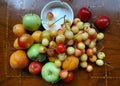 Different color fruits on the table Royalty Free Stock Photo