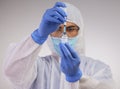 There will be no contaminations on my watch. a medical professional standing in a disposable hazmat suit and using a Royalty Free Stock Photo