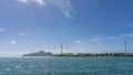 There are wind turbines on an island in the ocean. Royalty Free Stock Photo