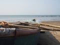 There is a wooden fishing boat on the beach. A tool for fishing the local population Royalty Free Stock Photo