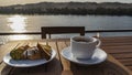 There is a wooden table on the upper deck of the cruise ship. Royalty Free Stock Photo