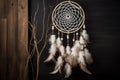 There's a dreamcatcher hanging on the wall. AI Generated Royalty Free Stock Photo