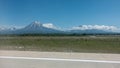 There are yellow and white lines on the runway of the airfield.