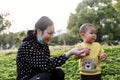 Asia Chinese little boy toddler child and mother Mom play games have fun outside embrace nature outdoor carefree childhood play