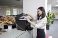 Asia Chinese office lady woman girl print copy paper use printer copier at work smile wear business occupation suit workplace