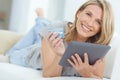 Theres just so much to choose from. Portrait of a happy mature woman doing some online shopping at home using her Royalty Free Stock Photo