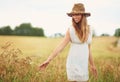 Theres a lot of beauty in ordinary things. Cropped shot of a young woman in a wheat field. Royalty Free Stock Photo