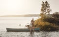 Theres a lot to love about life at the lake. a young couple going for a canoe ride on the lake. Royalty Free Stock Photo