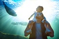 Theres much to see under the sea. a father and his little daughter looking at an exhibit in an aquarium.