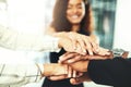 Theres no breaking our bond. Closeup shot of a group of businesspeople joining their hands together in a huddle. Royalty Free Stock Photo