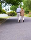 Theres no I in us. Low angle shot of a senior couple walking together.