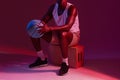 Theres no off season. Red filtered shot of an unrecognizable sportsman posing with a basketball in the studio. Royalty Free Stock Photo