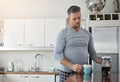 Theres nothing like a fresh cuppa to start the day. a man drinking coffee in the morning at home.