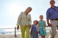 Theres nothing more special than a grandchild. grandparents walking hand in hand with their granddaughters on a Royalty Free Stock Photo