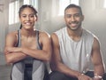 Theres something for everyone at the gym. two young athletes sitting together at the gym.