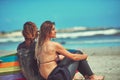 Theres something soothing about the surf. a young couple surfing at the beach.