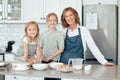 Theres always something tasty to make at grandmas house. Portrait of a grandmother baking with her two granddaughters at